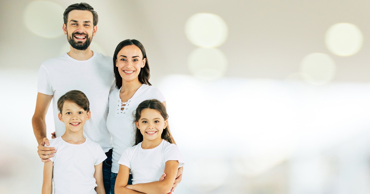 Mother father and kids smiling thanks to family dentistry