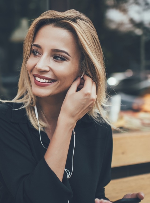 Woman with beautiful smile after cosmetic dentistry