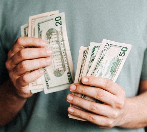 Male hands counting cash
