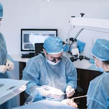 group of dentists performing dental implant surgery