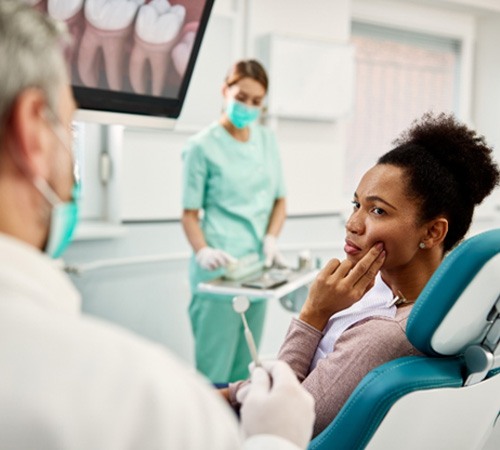 Woman in dental chair with toothache