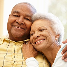 Couple smiling with dental implants in Houston