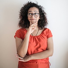 Thinking woman with hand on face