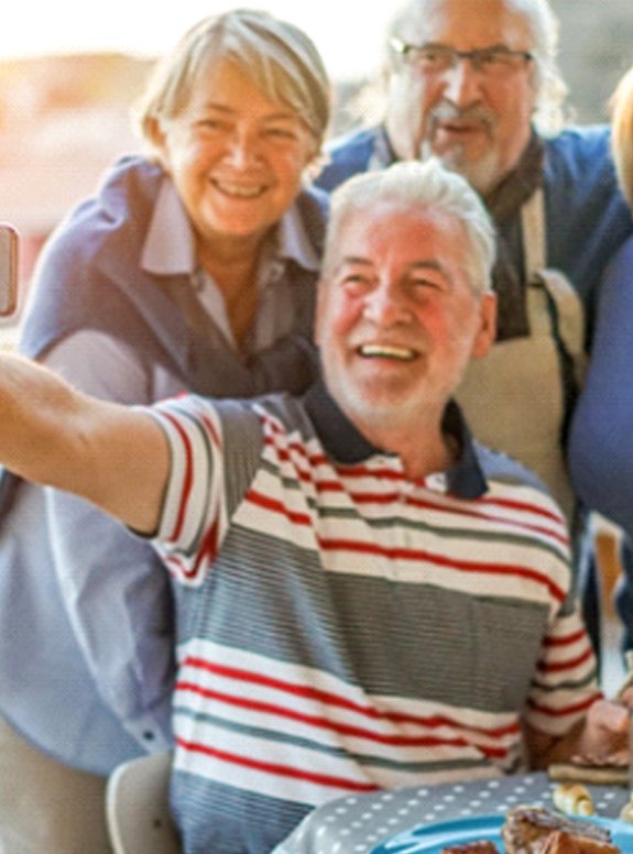 Senior group smiling after MetLife dentist in Houston