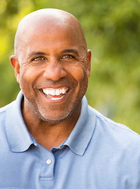 Smiling man after root canal therapy